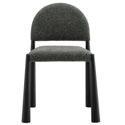 Dark gray tweed upholstered dining chair with a rounded back and black metal legs.