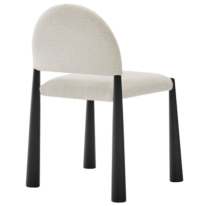 Cream textured upholstered armless dining chair with curved back and black tapered legs.