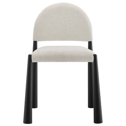 White upholstered fabric dining chair with rounded back and black cylindrical legs, modern minimalist style.