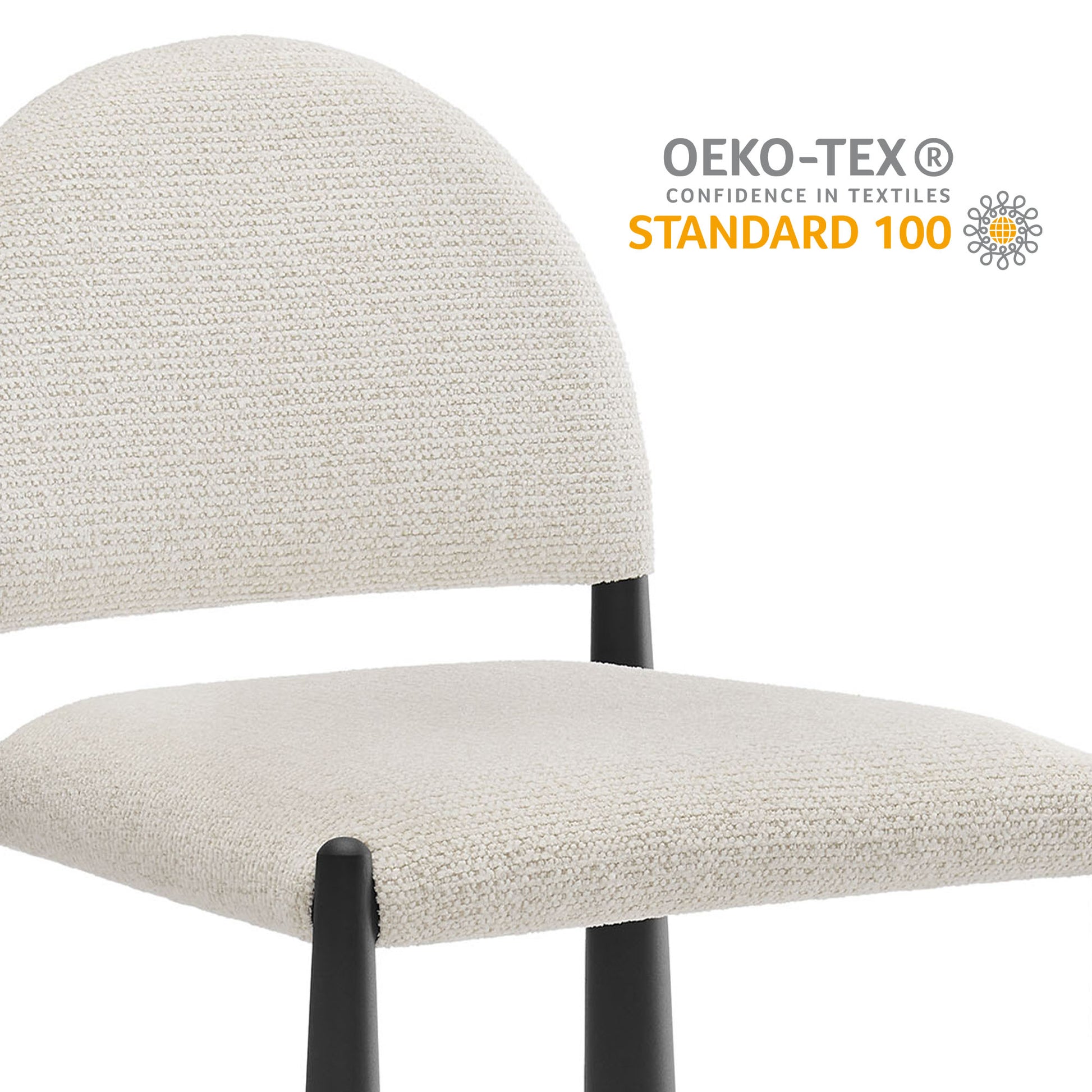 Cream textured fabric dining chair with rounded back and black metal legs; OEKO-TEX Standard 100.