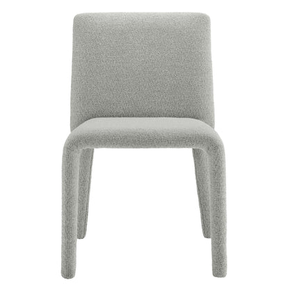Light dove gray boucle upholstered dining chair with rounded back and integrated curved legs, modern minimalist design.