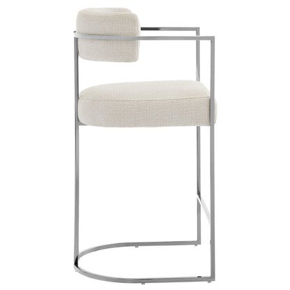 Silver metal cantilever bar stool with cream upholstered seat & back cushion; circular base, modern kitchen island seating.