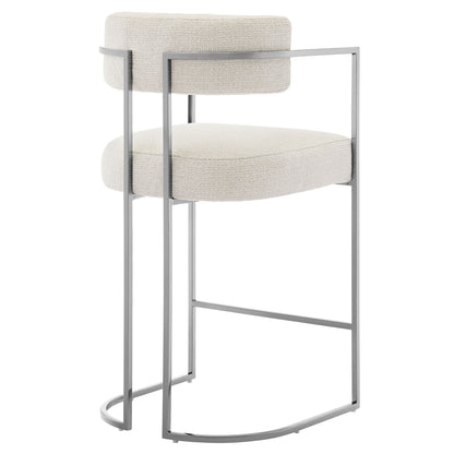 Silver metal-frame bar stool with cream upholstered seat and back cushion; rounded footrest, contemporary minimalist design.
