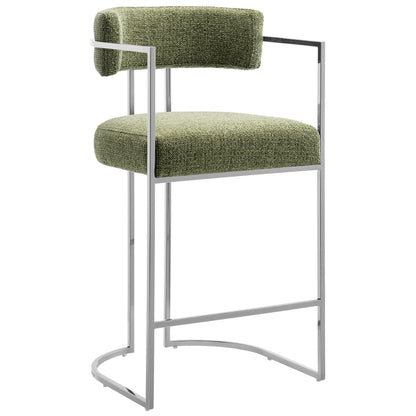 Green textured fabric counter stool with a chrome metal frame, curved back, curved footrest and slim armrests.