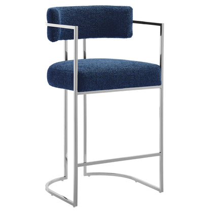 Navy blue velvet upholstered counter stool with chrome cantilever frame and curved back.