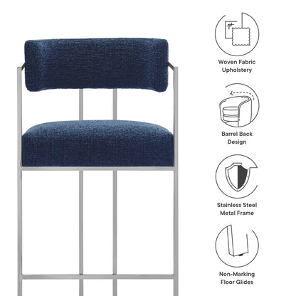 Navy woven fabric upholstered counter stool with curved back and slim metal frame.