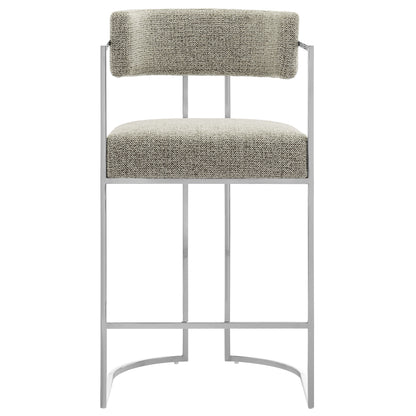Modern silver metal barstool with beige tweed upholstered seat and back cushion; slim frame and curved footrest.