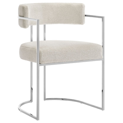 Cream/white boucle upholstered dining chair with slim metal frame, curved back and rectangular seat and back cushions.