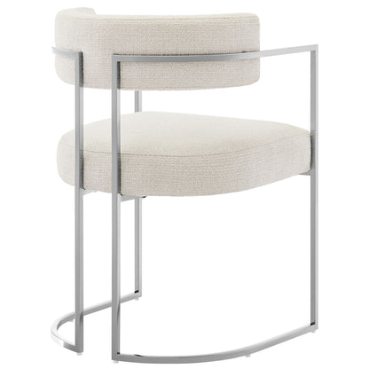 White boucle upholstered dining accent chair with a slim silver metal frame and curved back.
