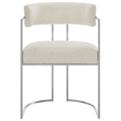 Modern dining accent chair with curved back, cream fabric upholstery and a silver metal frame.