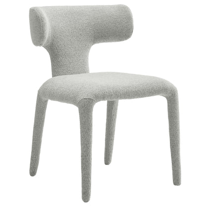 Light dove gray boucle upholstered dining chairs with curved backs and tapered legs.