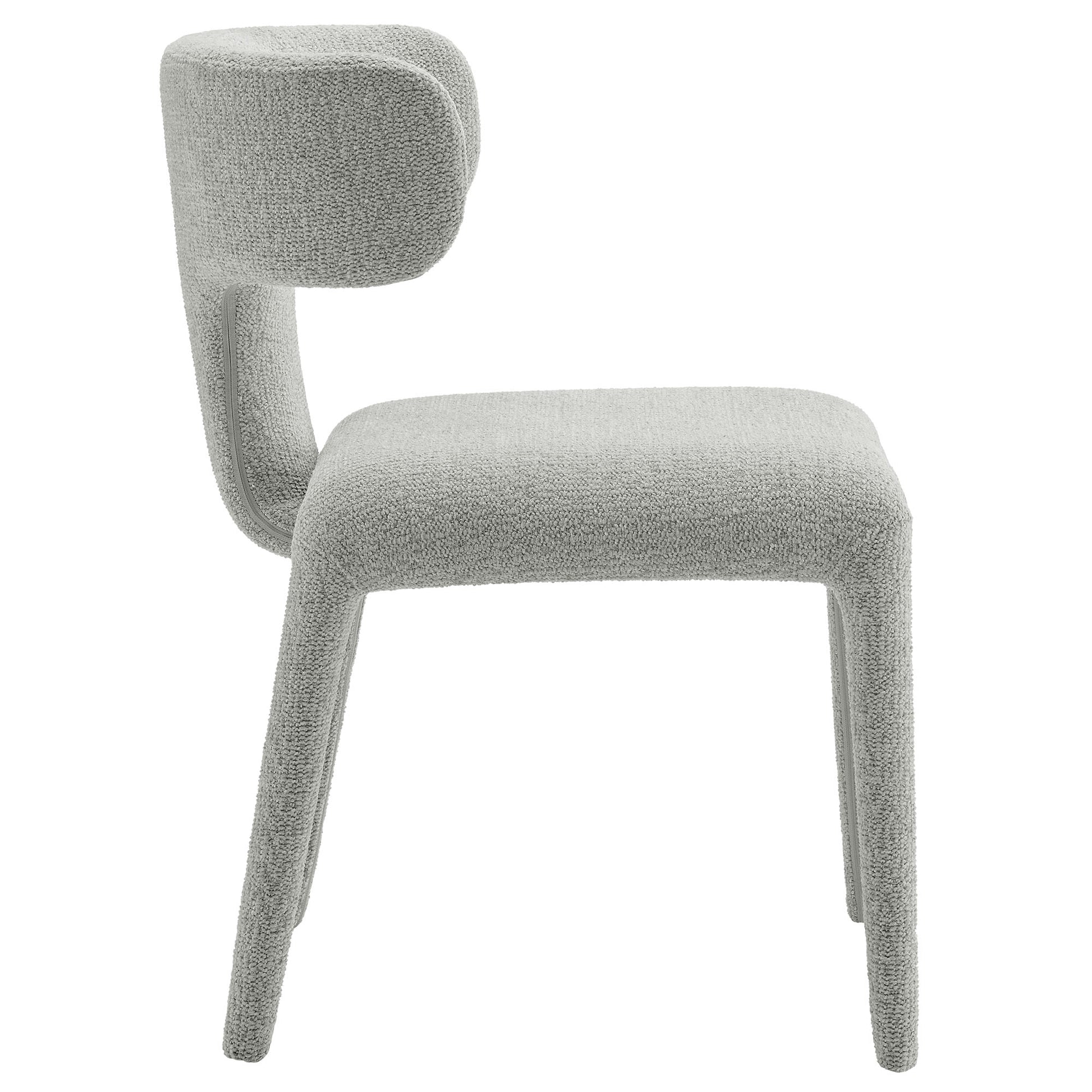 Light gray boucle upholstered dining chair with curved backrest and four tapered legs.