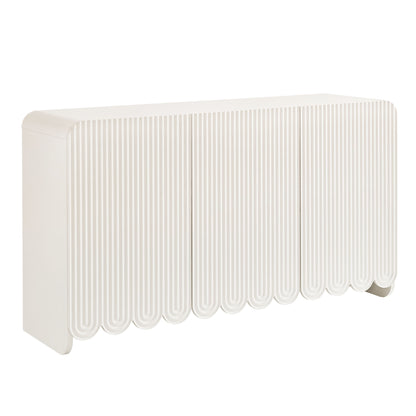 White sideboard storage cabinet with fluted and scalloped detailing.
