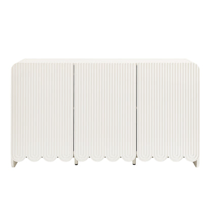 White three-panel sideboard storage cabinet with fluted doors and scalloped bottom edge.