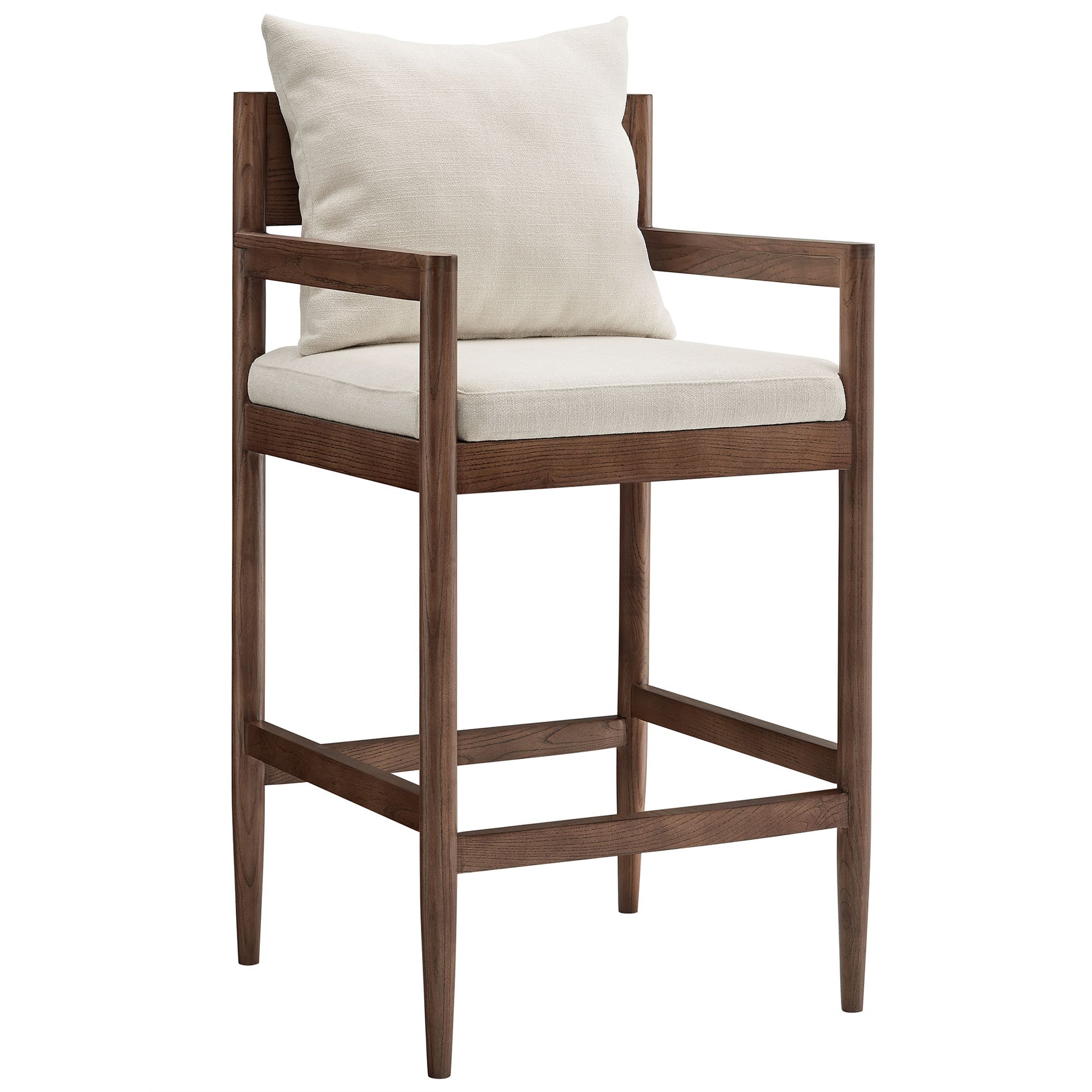 White wood bar stool with cream upholstered seat and back cushions, square arms, tapered legs, and a footrest.