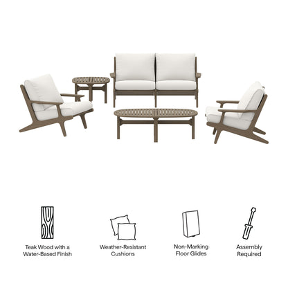 Teak outdoor lounge set with white cushions: two armchairs, a loveseat, two round side tables, and a coffee table.