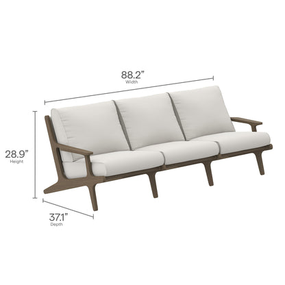 Saratoga three-seat sofa with cream cushions and warm brown wood frame; mid-century modern style.