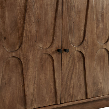 Mango wood sideboard cabinet with arched-panel doors, small dark knobs, brown wood grain.