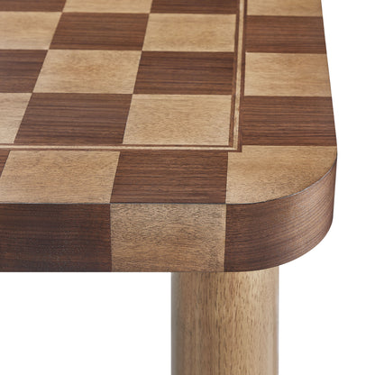 Two-tone square checkered dining table top with alternating light and dark squares, rounded corners and wooden legs.