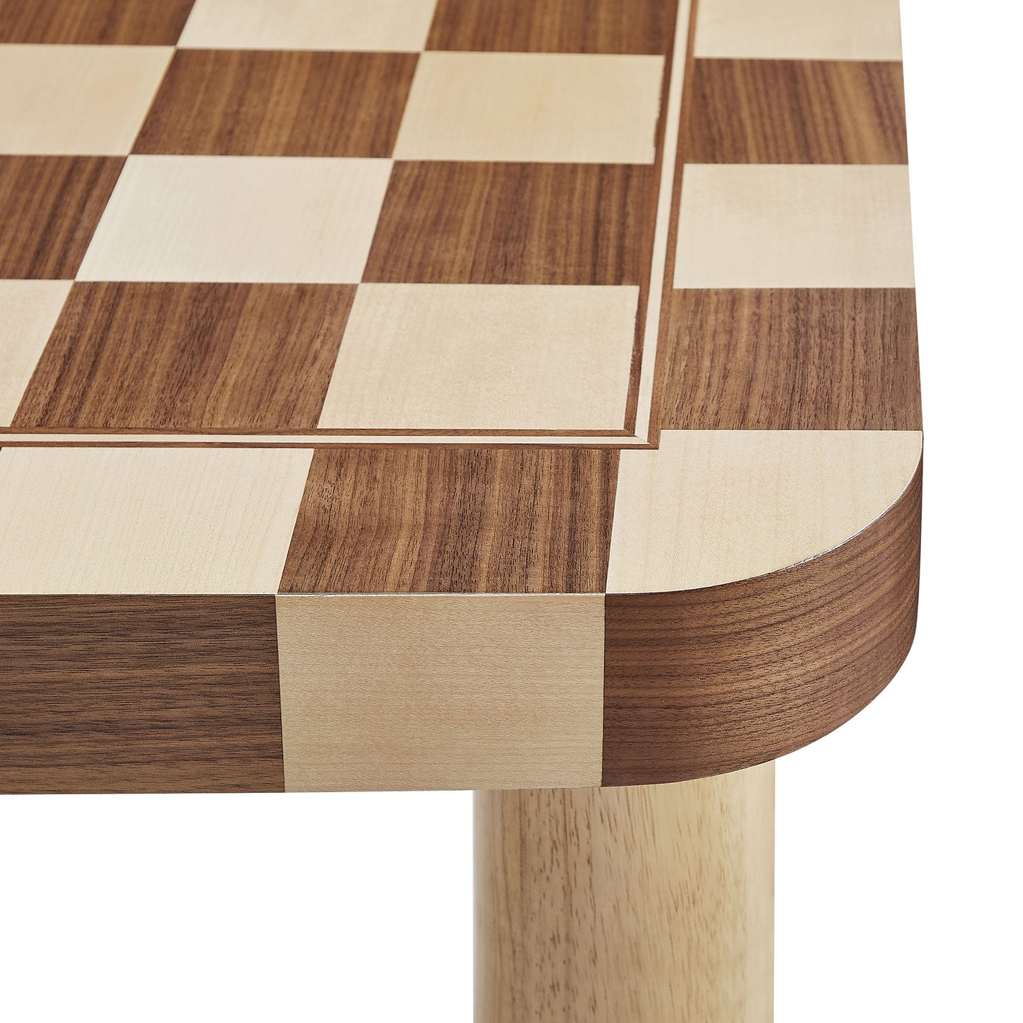 Two-tone wooden chessboard tabletop on a square dining table; alternating light beige and dark brown squares; wooden legs visible.