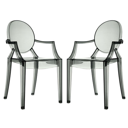 Pair of smoked transparent acrylic chairs with round backrests and angular arms.