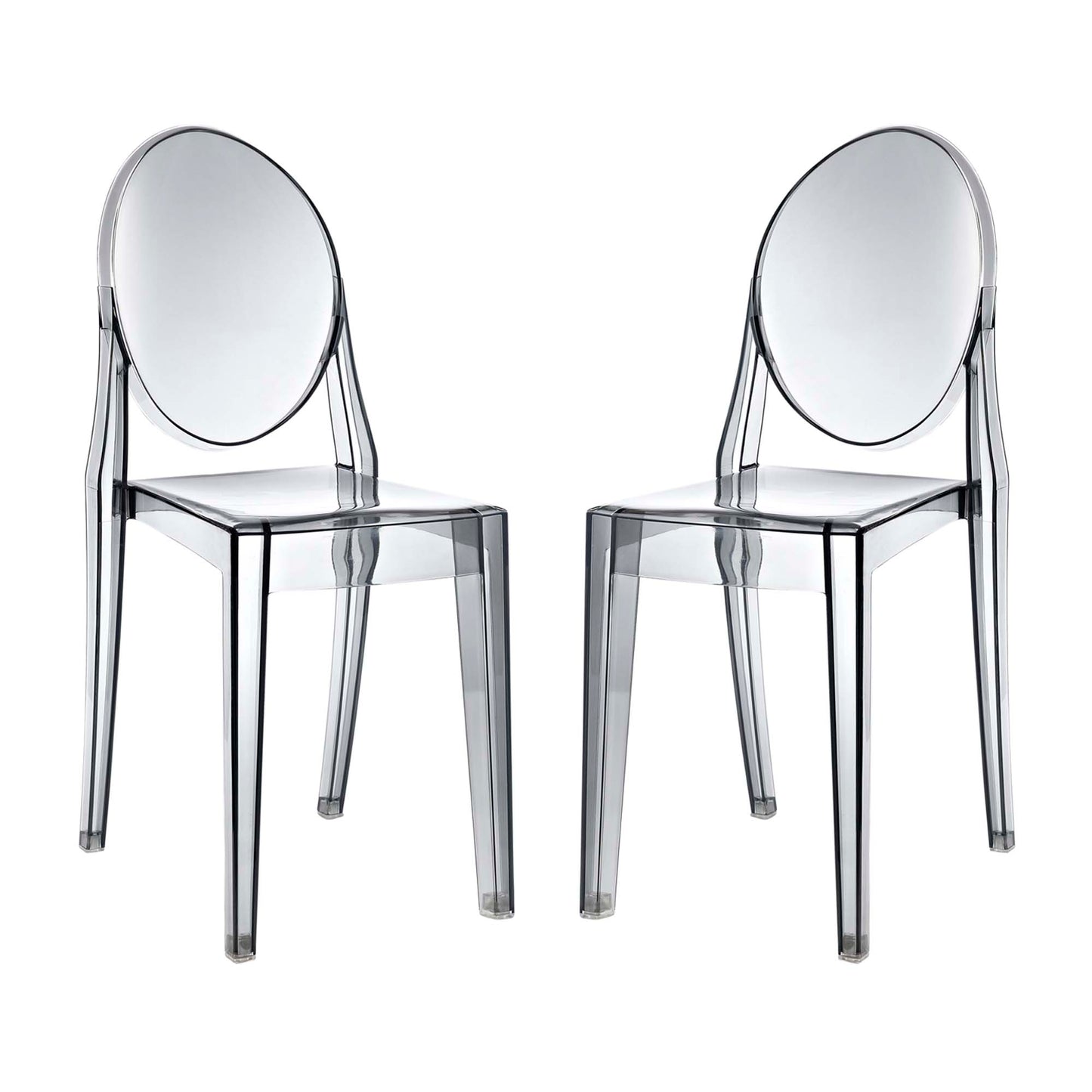 Two transparent acrylic chairs with oval backs and square seats; modern clear dining seating.