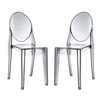 Two transparent acrylic chairs with oval backs and square seats; modern clear dining seating.