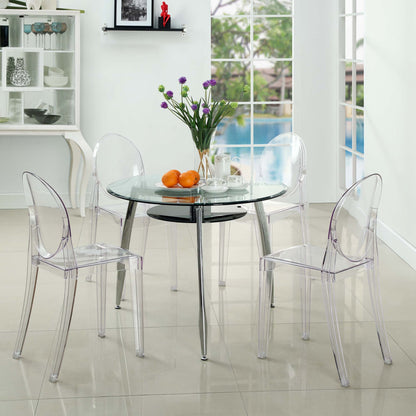 Clear acrylic ghost dining chairs (set of 4) in a bright modern dining room, with a vase of purple flowers and oranges on the table