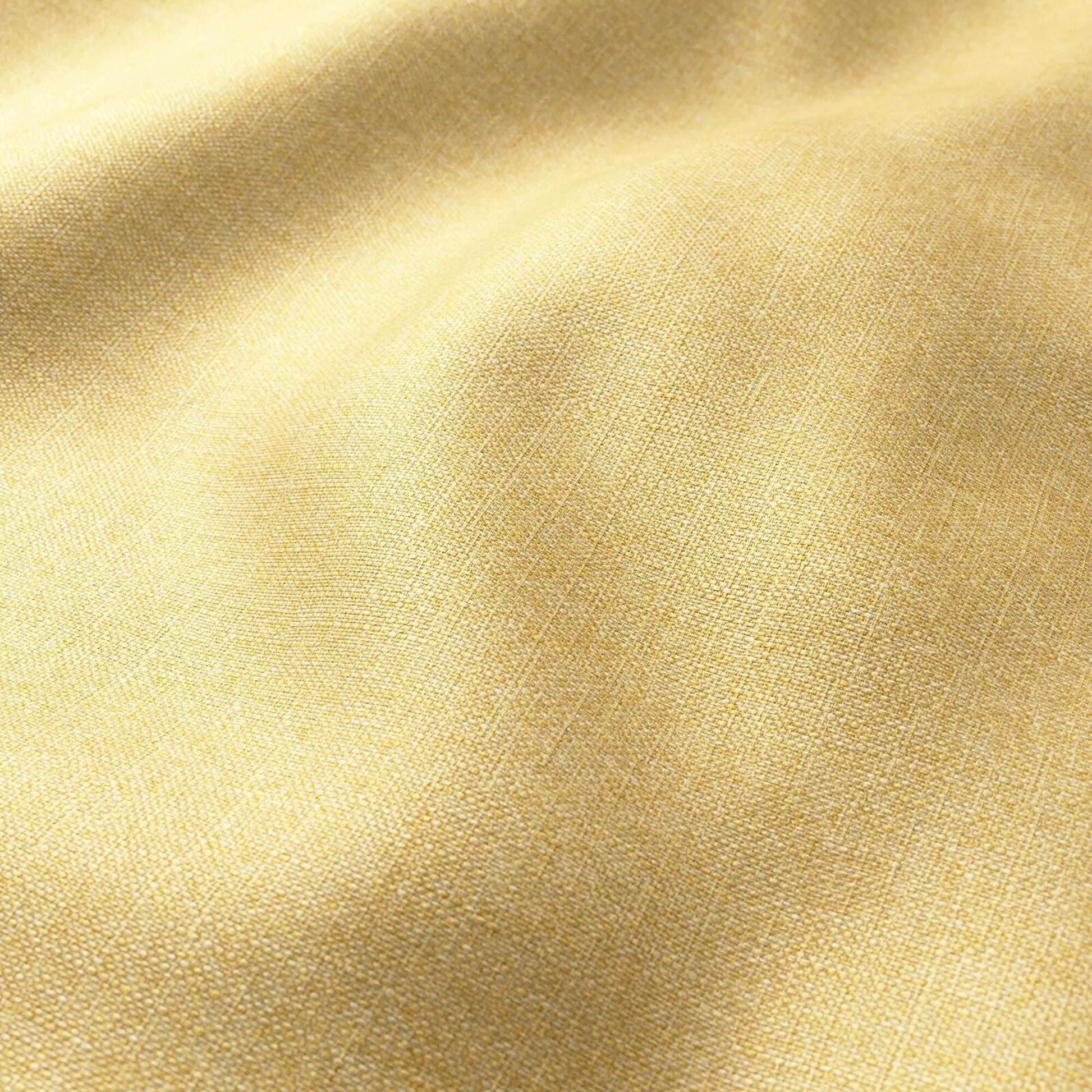 Pale golden-yellow woven fabric with visible texture and soft folds.