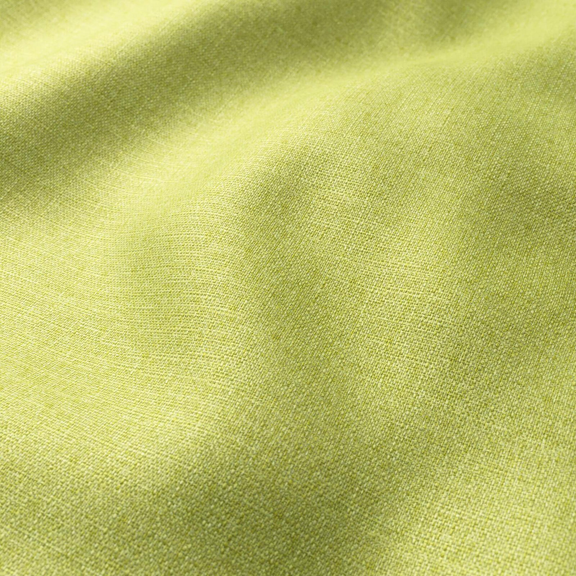 Lime green woven fabric close-up with soft folds and a textured surface