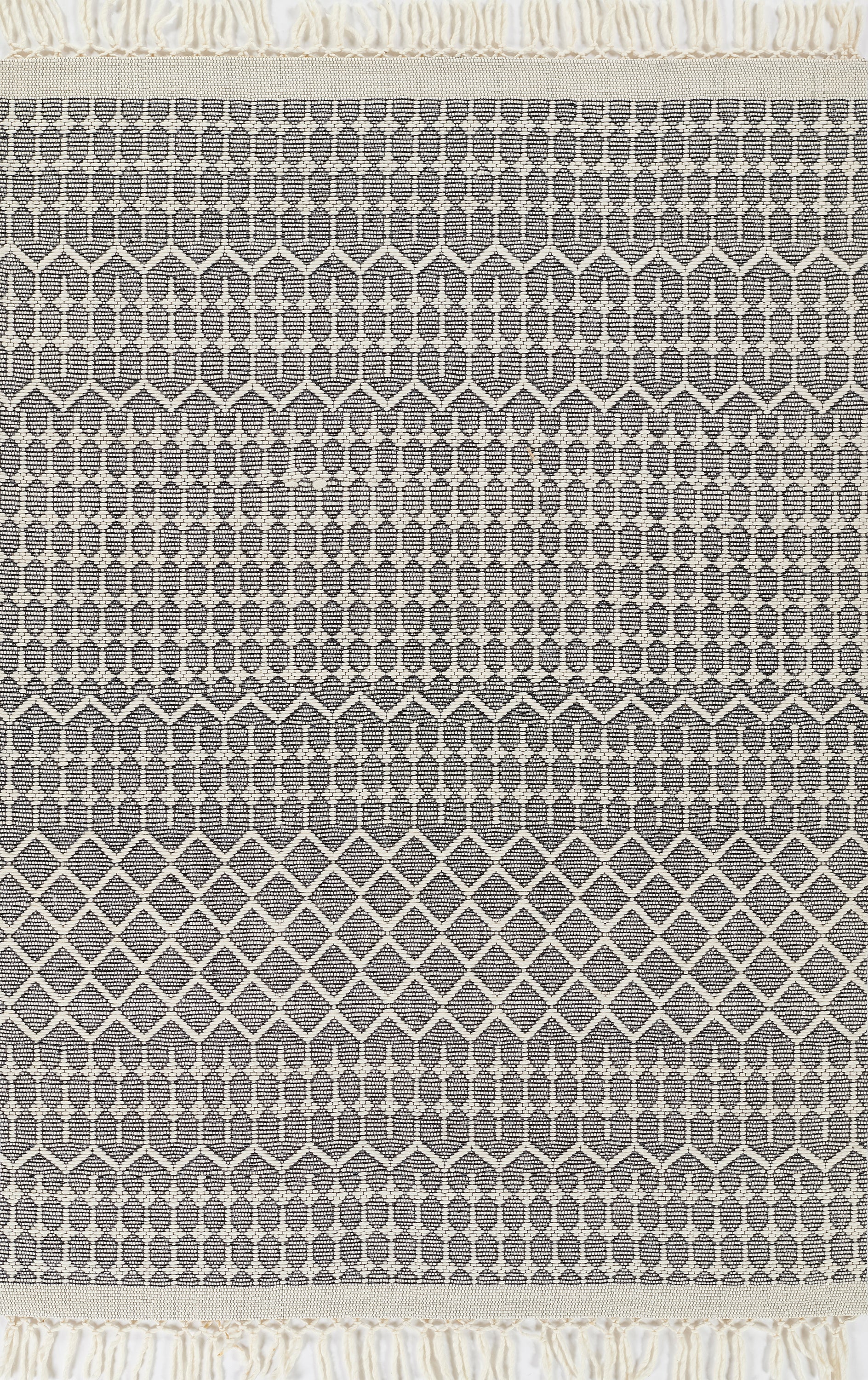 Charcoal gray woven rug with cream geometric diamond lattice bands and cream fringe.