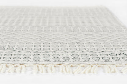 Light gray lace rug, 2' x 3', with geometric diamond pattern and cream fringe
