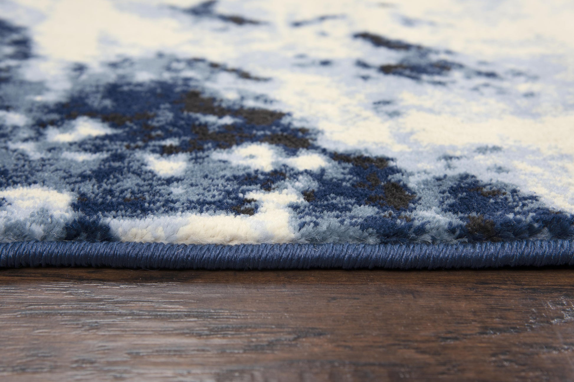 5x8 blue abstract area rug with mid century modern design, soft heat set polypropylene rug, power loomed durable synthetic rug for living room or bedroom, modern blue rug with artistic pattern, easy care high-traffic area rug, contemporary home decor carpet