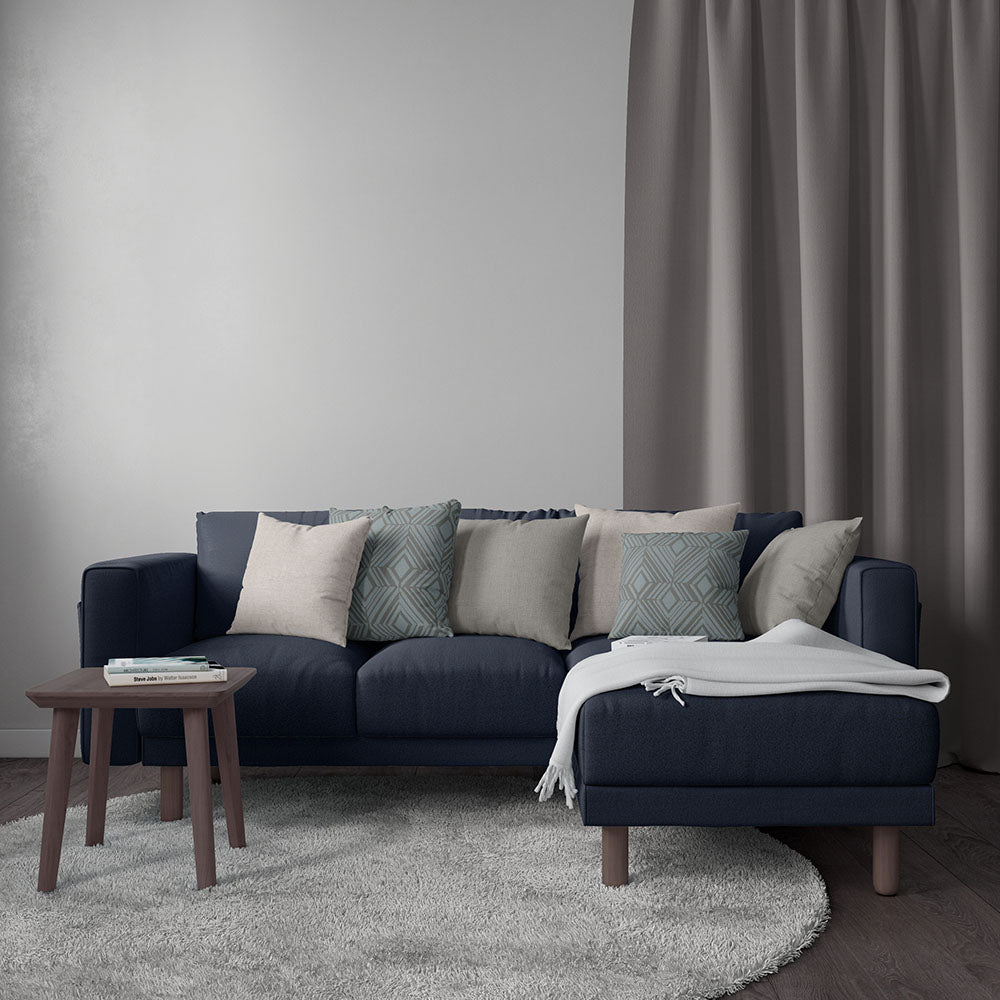Dark navy textured upholstery fabric in a living-room setting.