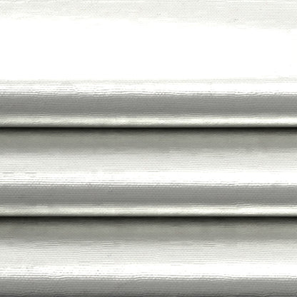 Close-up of gray solid fabric with subtle texture and soft shadows.