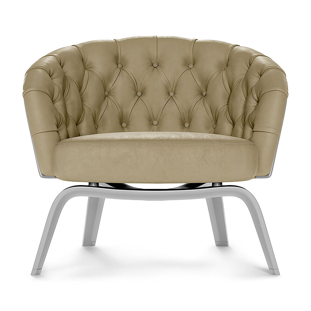 Beige tufted patent fabric club chair with circular back, button detailing, and sleek silver metal legs.