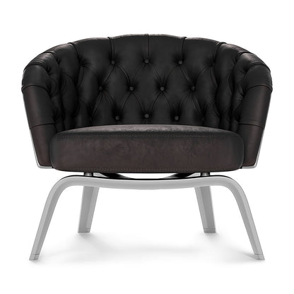 Red solid patent fabric lounge chair with curved back, round cushion seat, and metal sled legs.
