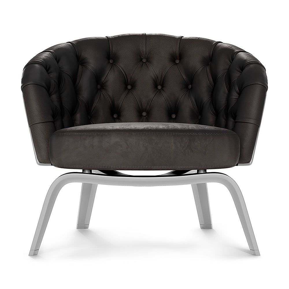 Dark brown tufted fabric lounge chair with barrel-style back, round seat cushion, and light gray metal sled legs.