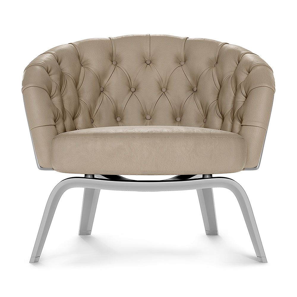 Beige tufted barrel chair with round back, button upholstery, and curved gray metal legs.