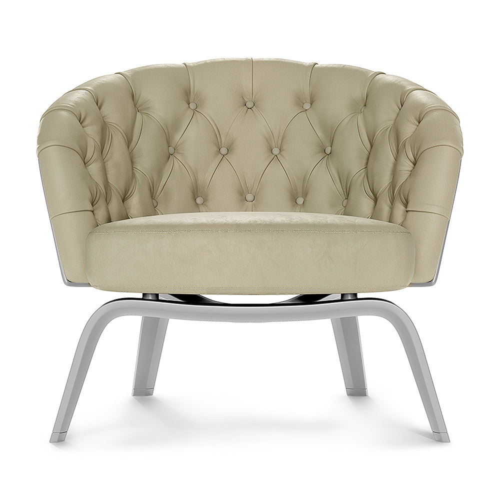 Beige tufted round barrel chair with button tufting and curved metal sled-base legs, plush upholstery, modern lounge seating.