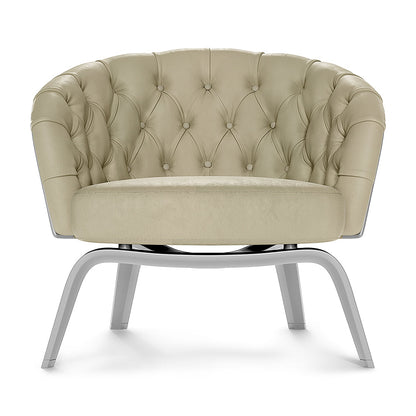 Beige tufted round barrel chair with button tufting and curved metal sled-base legs, plush upholstery, modern lounge seating.