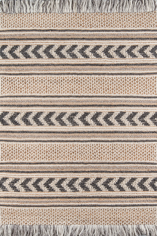 Beige and navy chevron-striped woven rug with fringe edges.