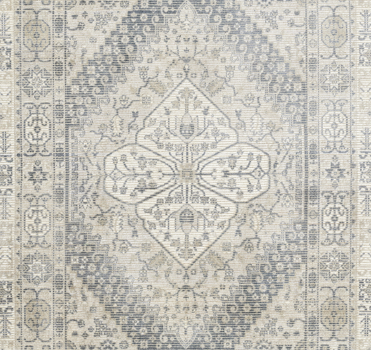 Gray and ivory distressed Persian-style area rug with central diamond medallion and ornate border.