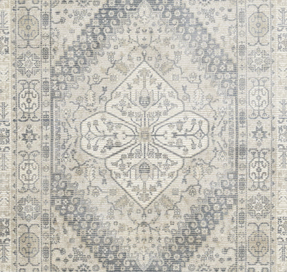 Gray and ivory distressed Persian-style area rug with central diamond medallion and ornate border.