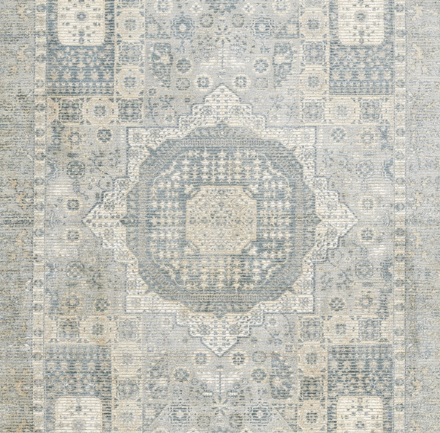 Blue and beige distressed oriental runner rug with a central medallion and intricate geometric floral motifs.