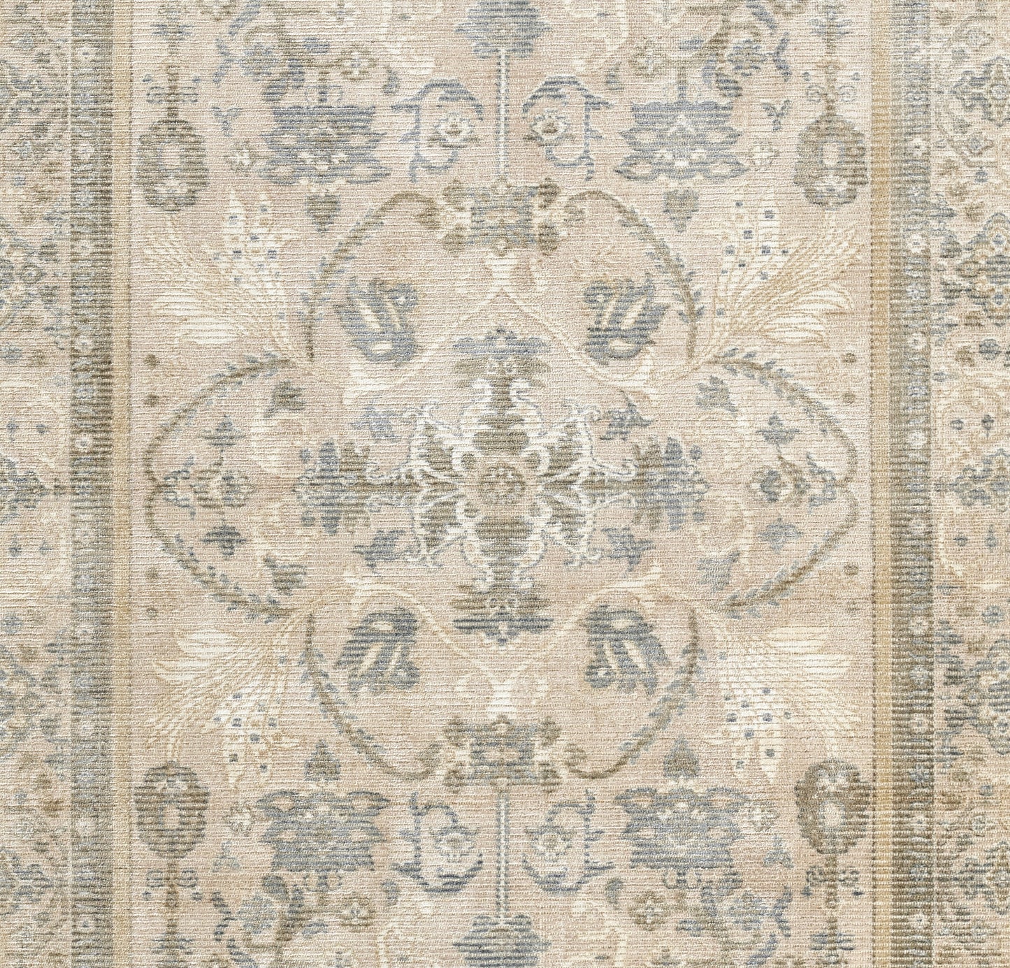 Beige distressed area rug with muted blue-gray floral medallion pattern in vintage Persian-inspired style.