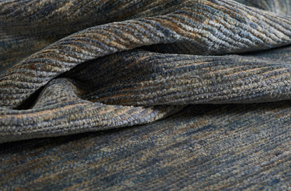 Blue-gray heathered rug with a textured pile; 5' x 8' area rug.