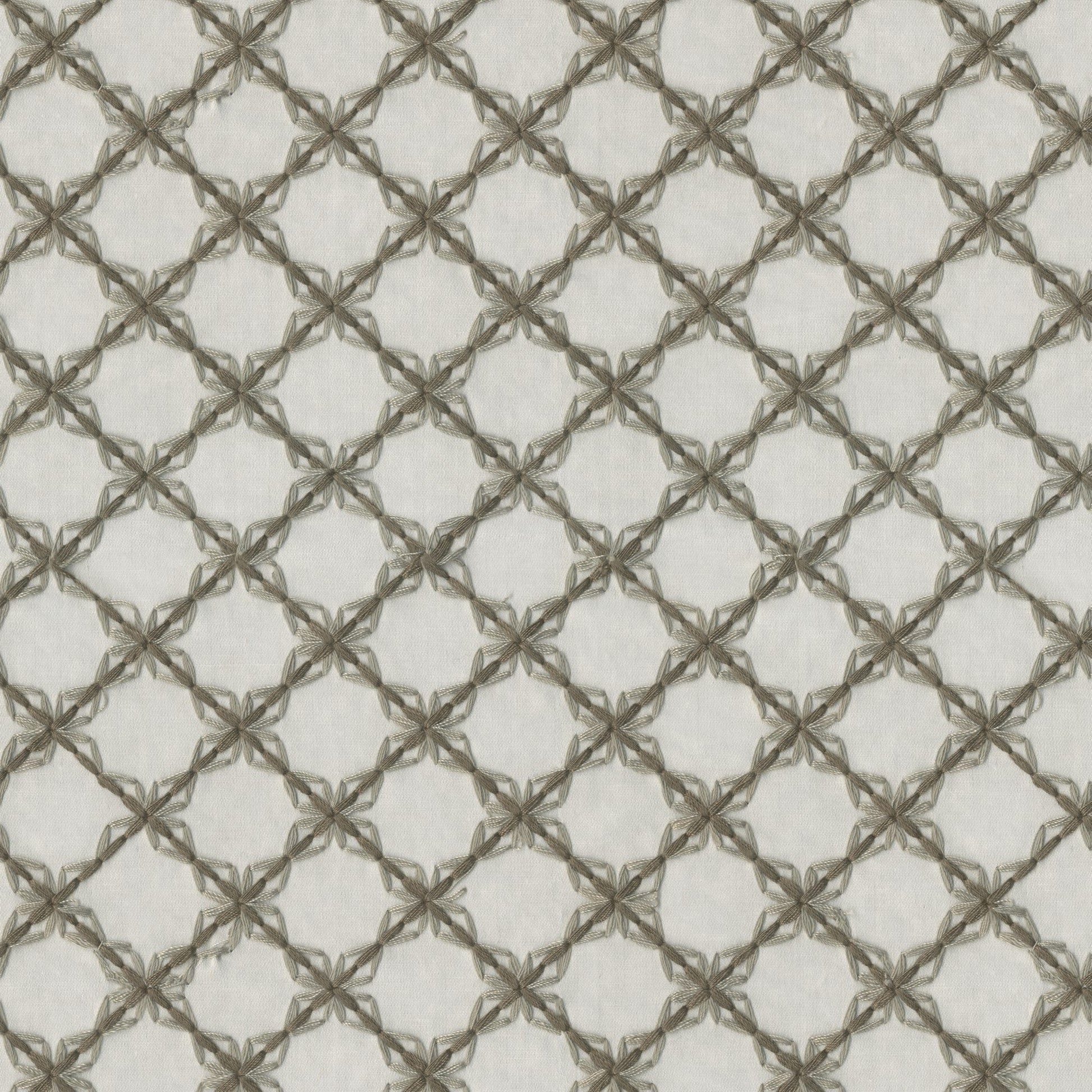 Brown embroidery forms a diamond lattice pattern on pale beige fabric; traditional embroidery style.