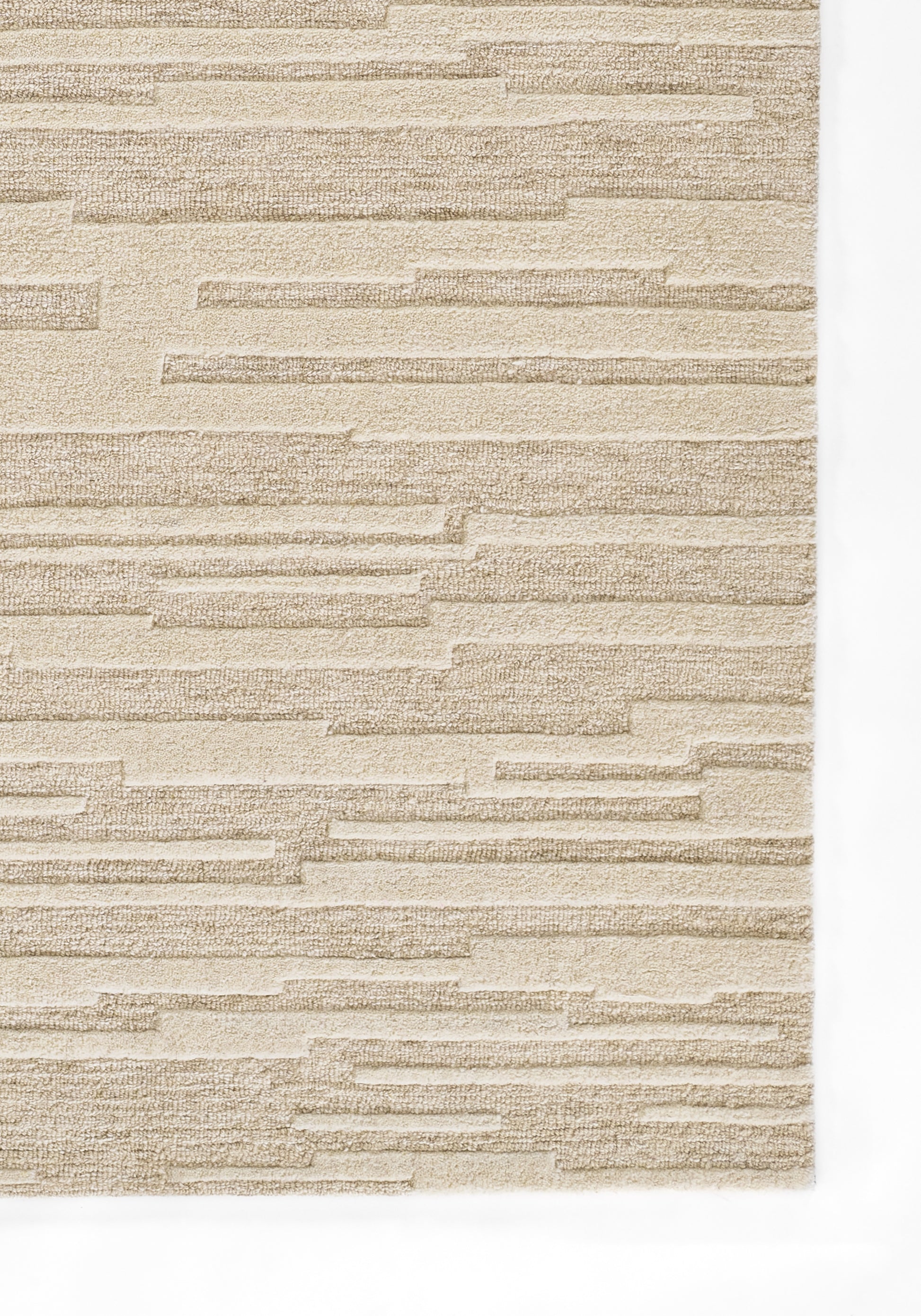 Taupe beige rug with a horizontal, staggered brick-style pattern, 2' x 4'.