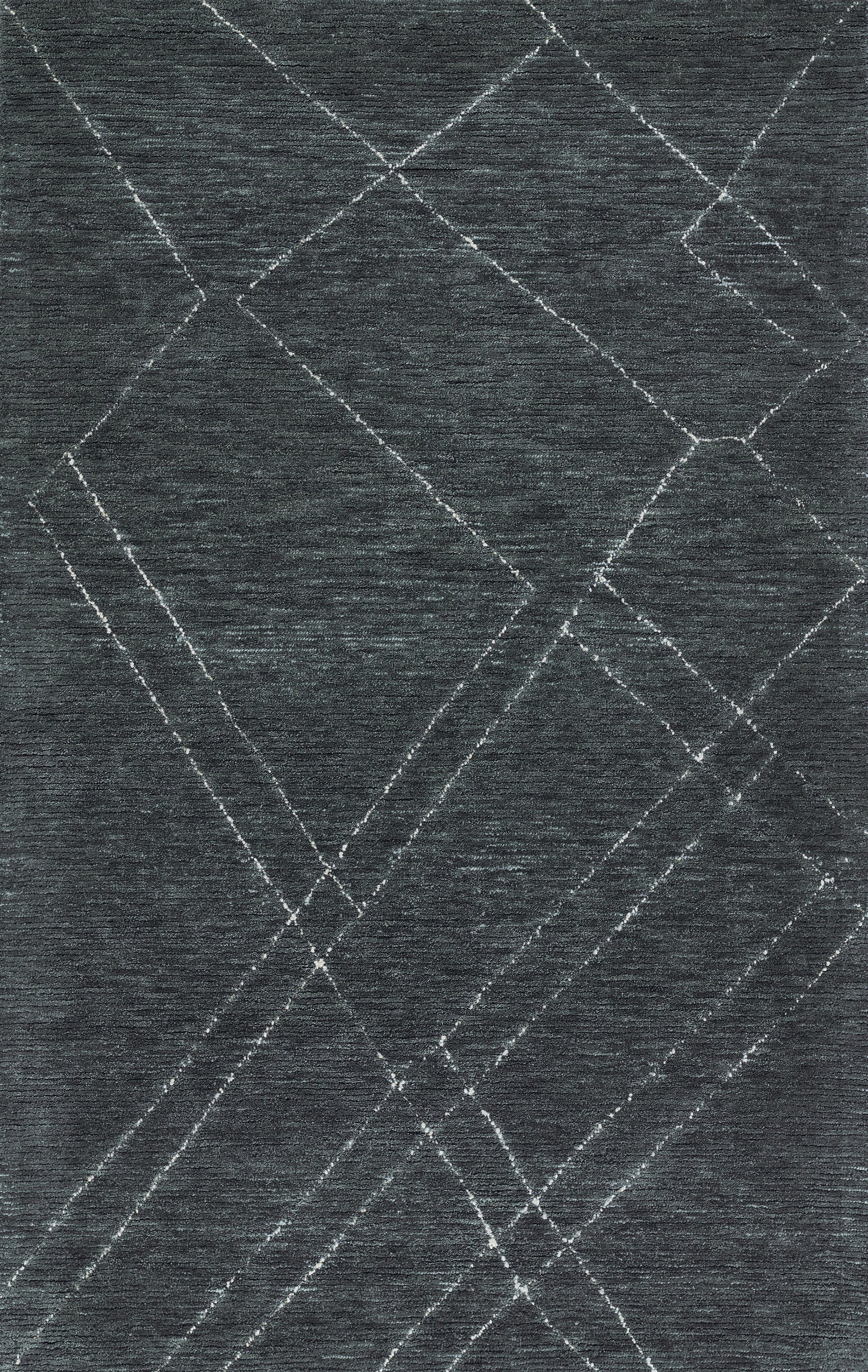 Dark blue area rug with a geometric pattern of white intersecting diamonds for a modern abstract look.